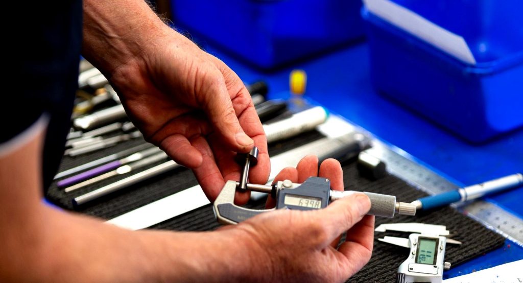 Precision measurement of carbide cutting tools during quality control in a New Zealand workshop